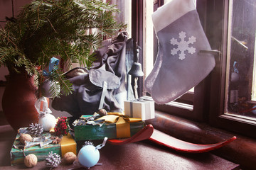 Fototapeta na wymiar Christmas Vintage Still Life with Skis ,Socks, and Decorations