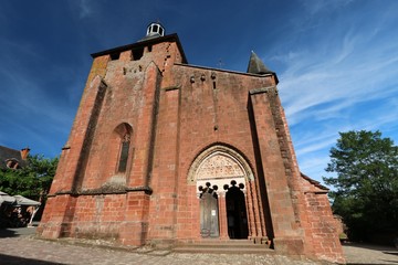 Fototapeta na wymiar Red bricks church in Collonges-La-Rouge, red village in Corrèze , France 