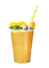 Tasty peach milkshake with cream and blueberry in plastic cup isolated on white