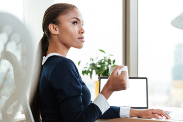 Young business woman with tea