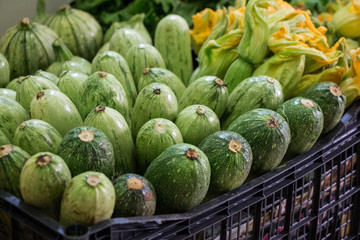 Zucchini in a box for sale at the market.