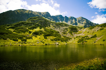 Fototapeta premium A beautiful mountain lake landscape in Tatry, Slovakia