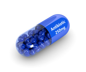 3d rendering of antibiotic pill with granules isolated over whit