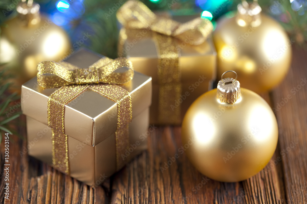 Sticker Gift boxes and Christmas balls on wooden table