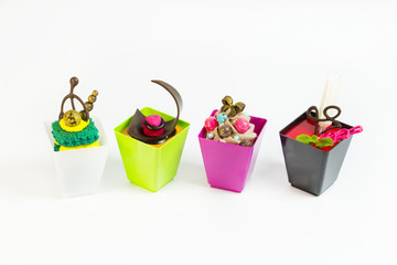 Mini desserts and meat canapes vegetable snacks in plastic cups canaps