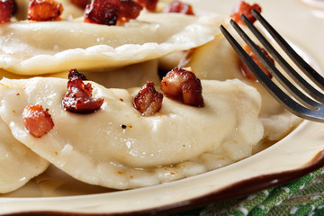 Dumplings with meat or cabbage and mushroom or cheese seasoned fried bacon