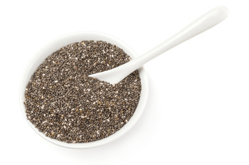 Nutritious chia seeds isolated over a white background