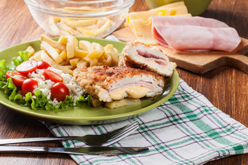 Cutlet Cordon Bleu with pork loin served with French fries and salad