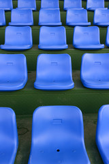 lines of blue stadium seats vertical composition