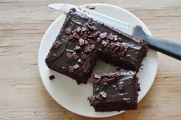 chocolate butter cake cut for piece on dish