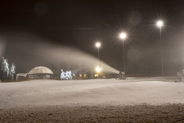 Snow cannon at night.