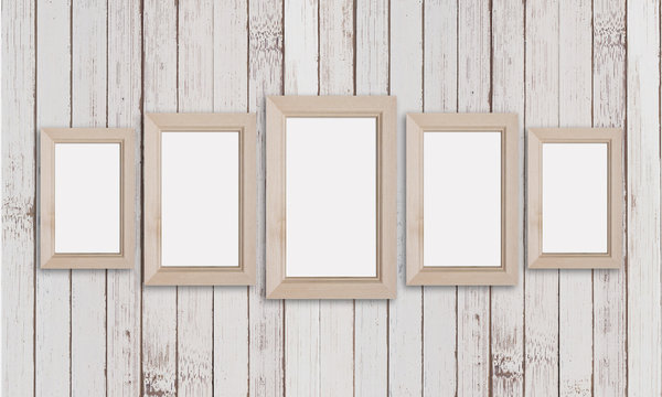 Group of five wooden frames on old painted panels wall. Rustic stytle decor mock up