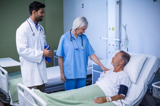 Doctor and nurse examining a patient