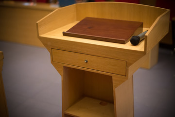 rostrum with a microphone in a reference room close up