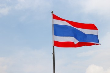Fototapeta na wymiar Thai flag, waving in the wind with beautiful with blue sky background
