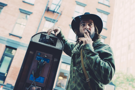 Man smoking near coinbox
