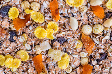 oatmeal in a sac, dried apricots, raisins, grapes, nuts on the b