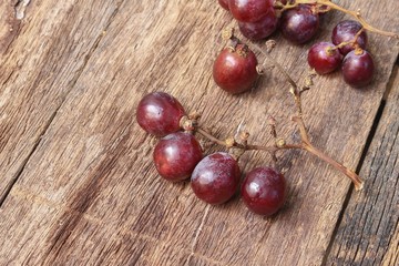 Grape red fresh on wooden table background