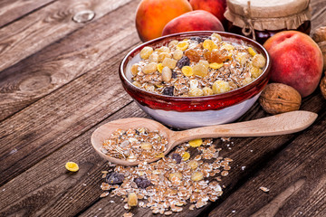 oatmeal in a sac, dried apricots, raisins, grapes, nuts on the b