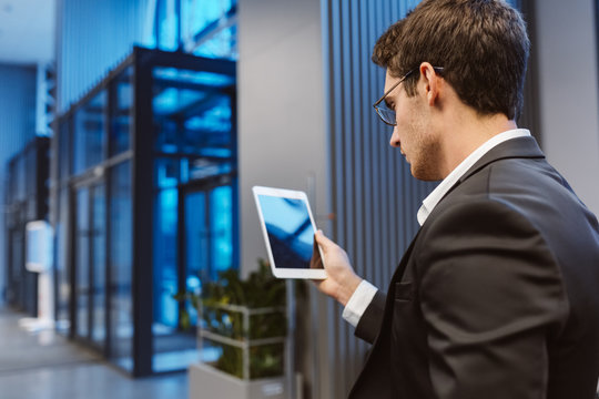 Back View Of Business Man With Laptop Computer