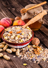 oatmeal in a sac, dried apricots, raisins, grapes, nuts on the b