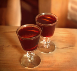 Glasses of mulled wine on wooden table