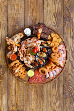 Seafood platter on wooden table background