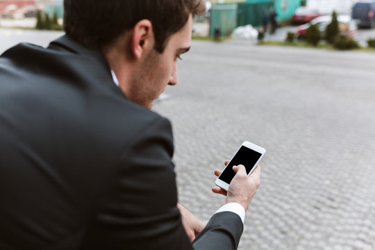 Back View Of Business Man With Phone