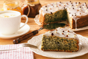 Homemade poppy seed cake and cup of coffee.