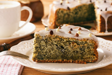 Homemade poppy seed cake and cup of coffee.