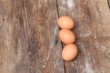  egg on wood background. Top view