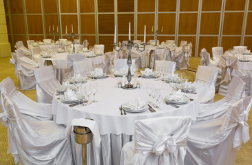 catering table set service with silverware, napkin and glass at restaurant before party
