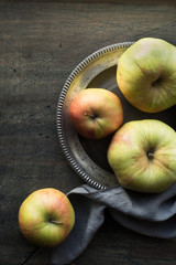Apples on the dark scratched table top view