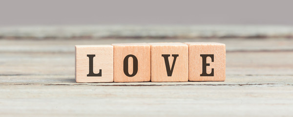 Word Love written on wood cubes