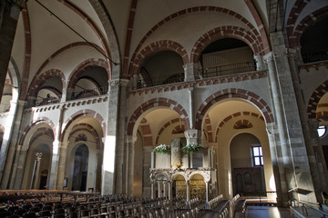 Fototapeta na wymiar Arches and pulpit in the Basilica of Saint Ambrogio