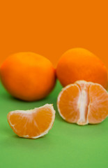 Fototapeta na wymiar orange mandarins on the green background
