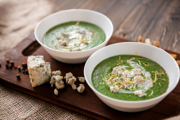 fresh and tasty green cream soup of spinach and broccoli