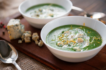 fresh and tasty green cream soup of spinach and broccoli