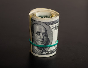 Stack of one hundred dollar bills close-up.
