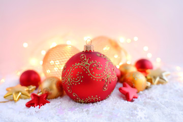 Christmas decorations on snow and Christmas lights. Festive Christmas background