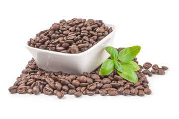 Pile of roasted coffee beans isolated on a white background cutout