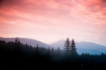 Naklejka na ściany i meble A beautiful colorful sunset in Tatra mountains. Decorative look