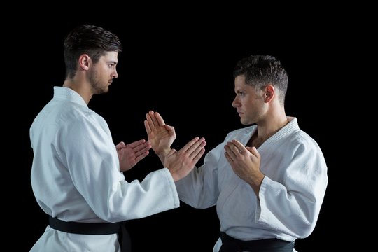 Two karate fighters practicing karate