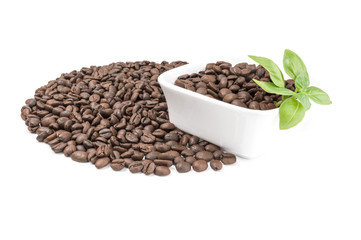 Pile of roasted coffee beans isolated on a white background cutout
