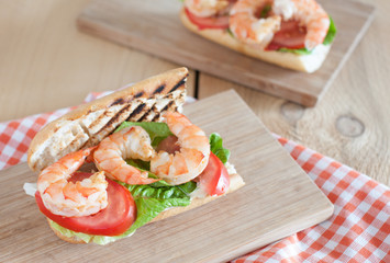 Homemade Shrimp Po Boy Sandwich with lettuce and tomatoes