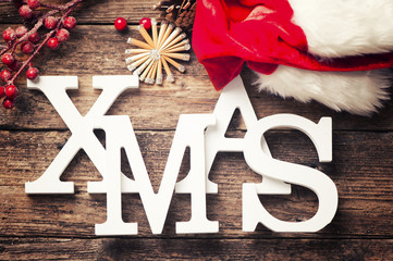 Xmas greeting message on wooden background