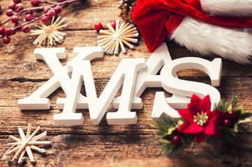 Xmas greeting message on wooden background