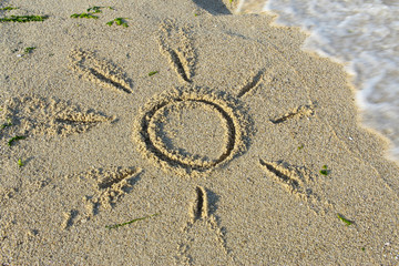 Sea beach sand waves and drawings of sun, love and heart