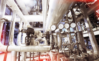 Equipment, cables and piping as found inside of a modern industr