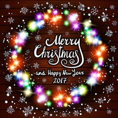 Merry Christmas and Happy New Year 2017. Glowing Christmas wreath made of led lights on the wooden background
